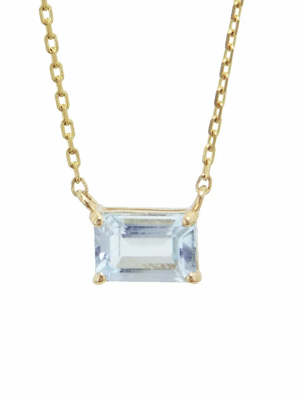 Layered pendant necklaces with multiple chains for a bold and stylish look -Emerald Cut Blue Topaz Yellow Gold Necklace