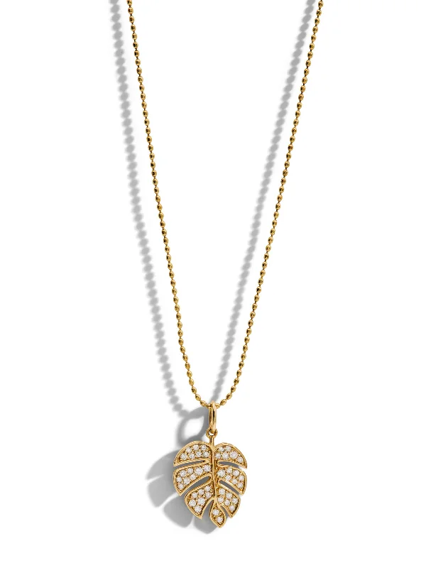 Rose gold pendant necklaces with sparkling accents for a soft, elegant vibe -Medium Diamond Monstera Leaf Yellow Gold Charm Necklace