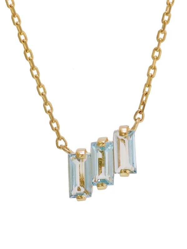 Animal-inspired pendant necklaces for nature lovers with detailed craftsmanship -Three Baguette Blue Topaz Yellow Gold Necklace