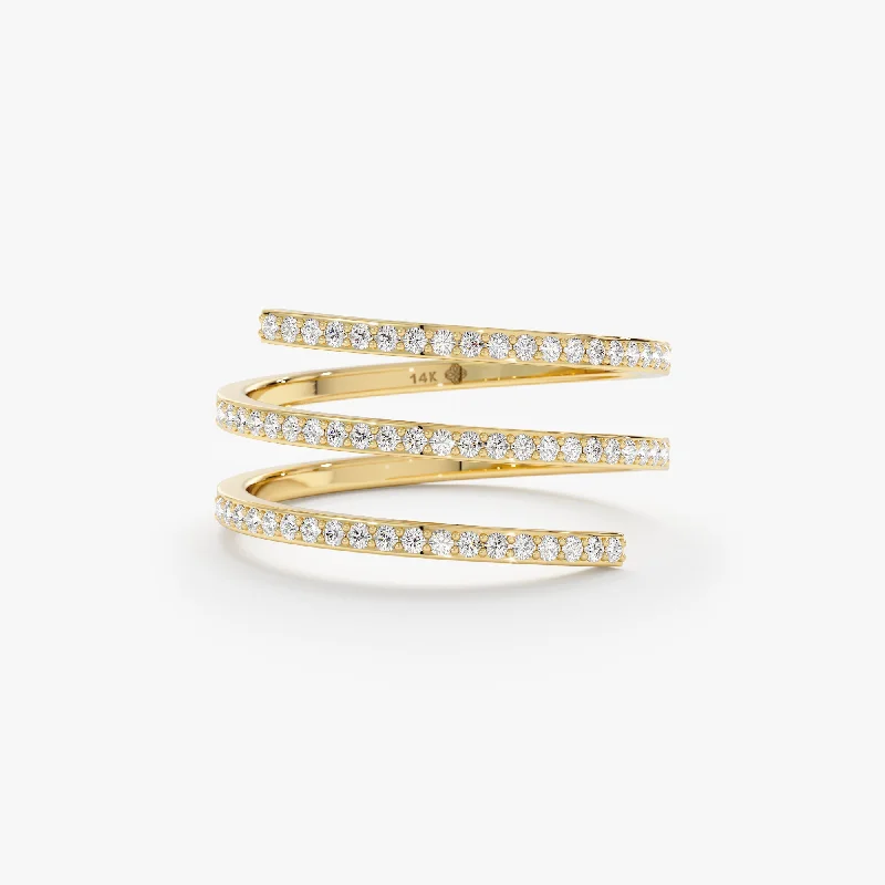 Gold rings bringing warm shine to fingers -Diamond Spiral Ring, Kehlani