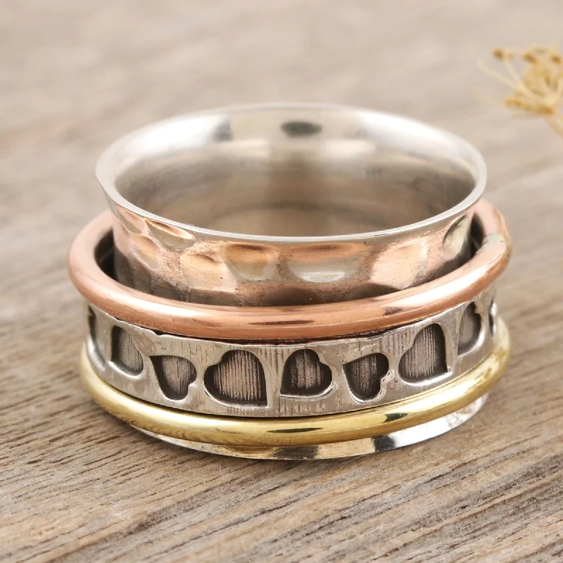 Edgy rings with sharp angles for modernity -Novica Handmade Endearing Hearts Multi-Metal Meditation Spinner Ring